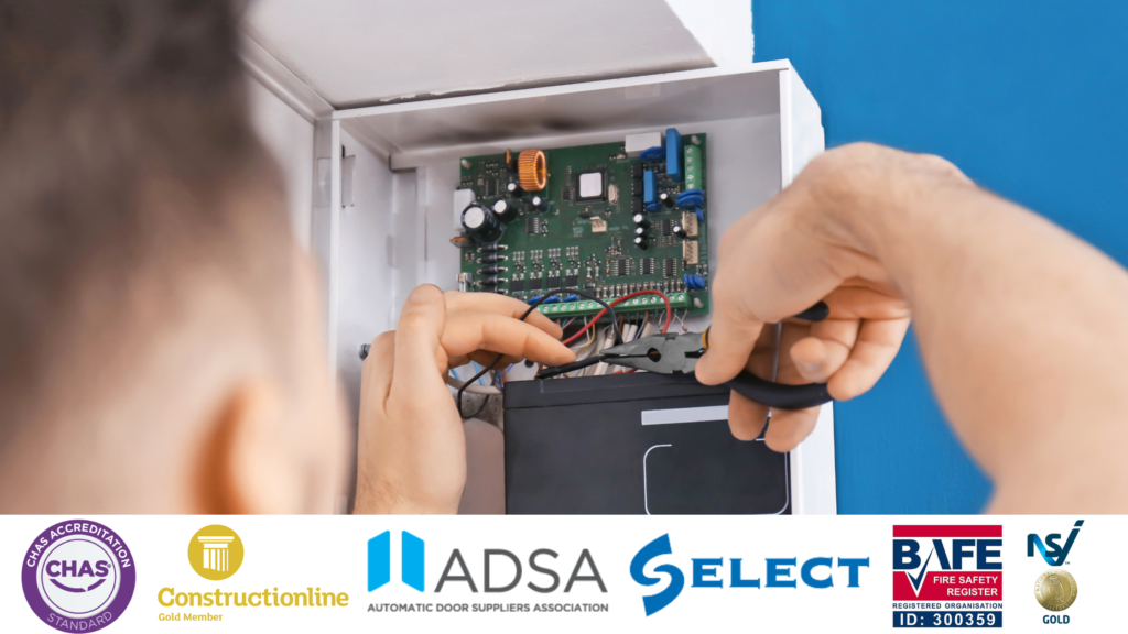 Image of someone installing a security alarm with several accreditation certificate logos along a banner below the image
